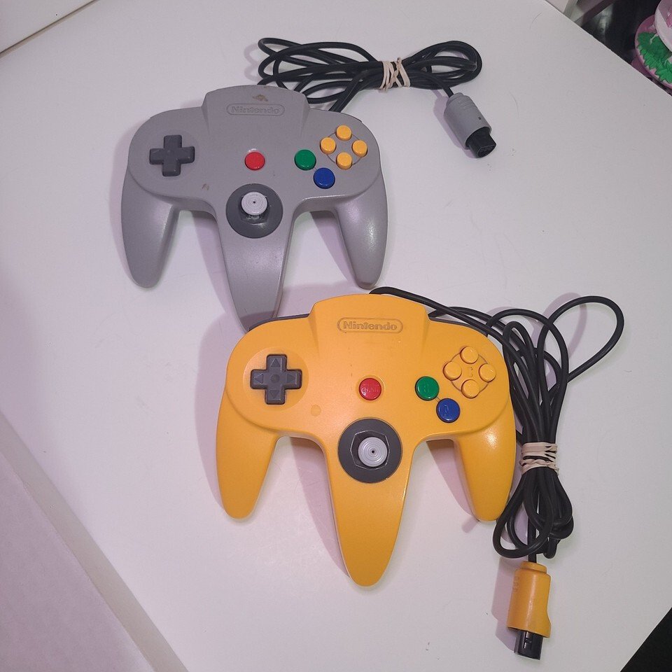 2x OEM Authentic Nintendo 64 Controllers - Original Gray & Yellow - Good Joystic