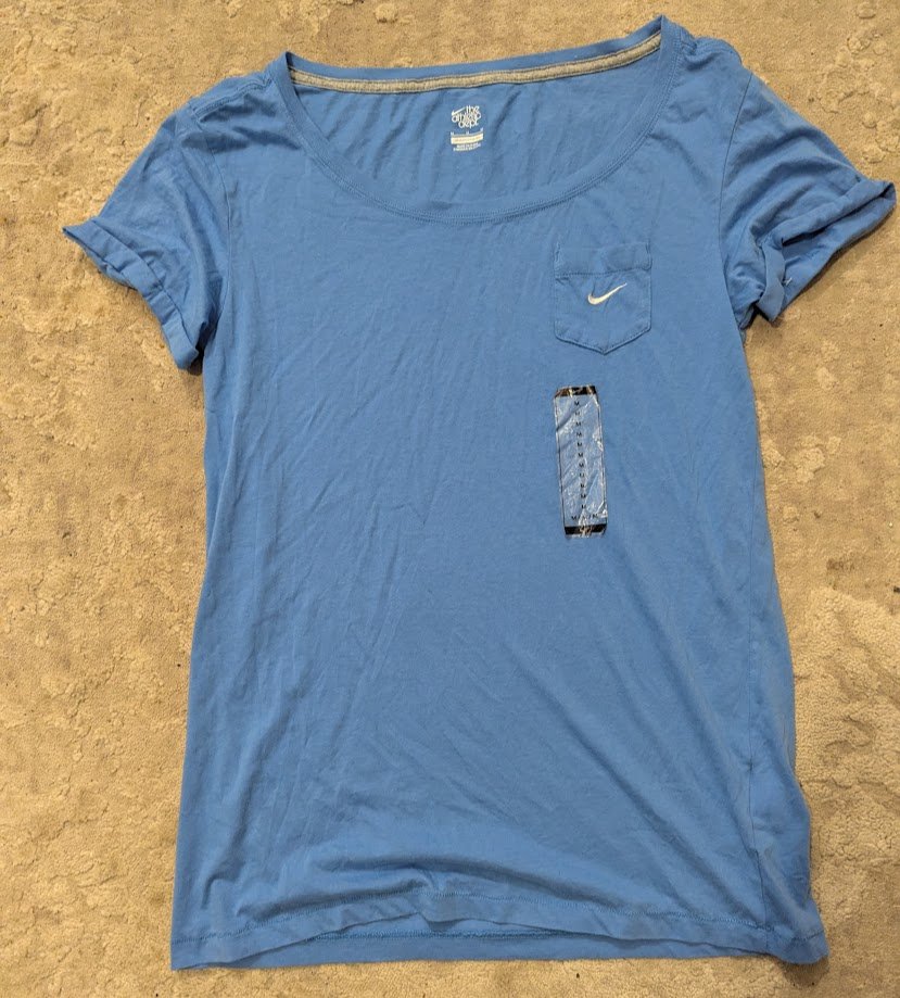 Nike Woman’s “The Athletic Dept” Short Sleeve T-Shirt with embroidered swoosh