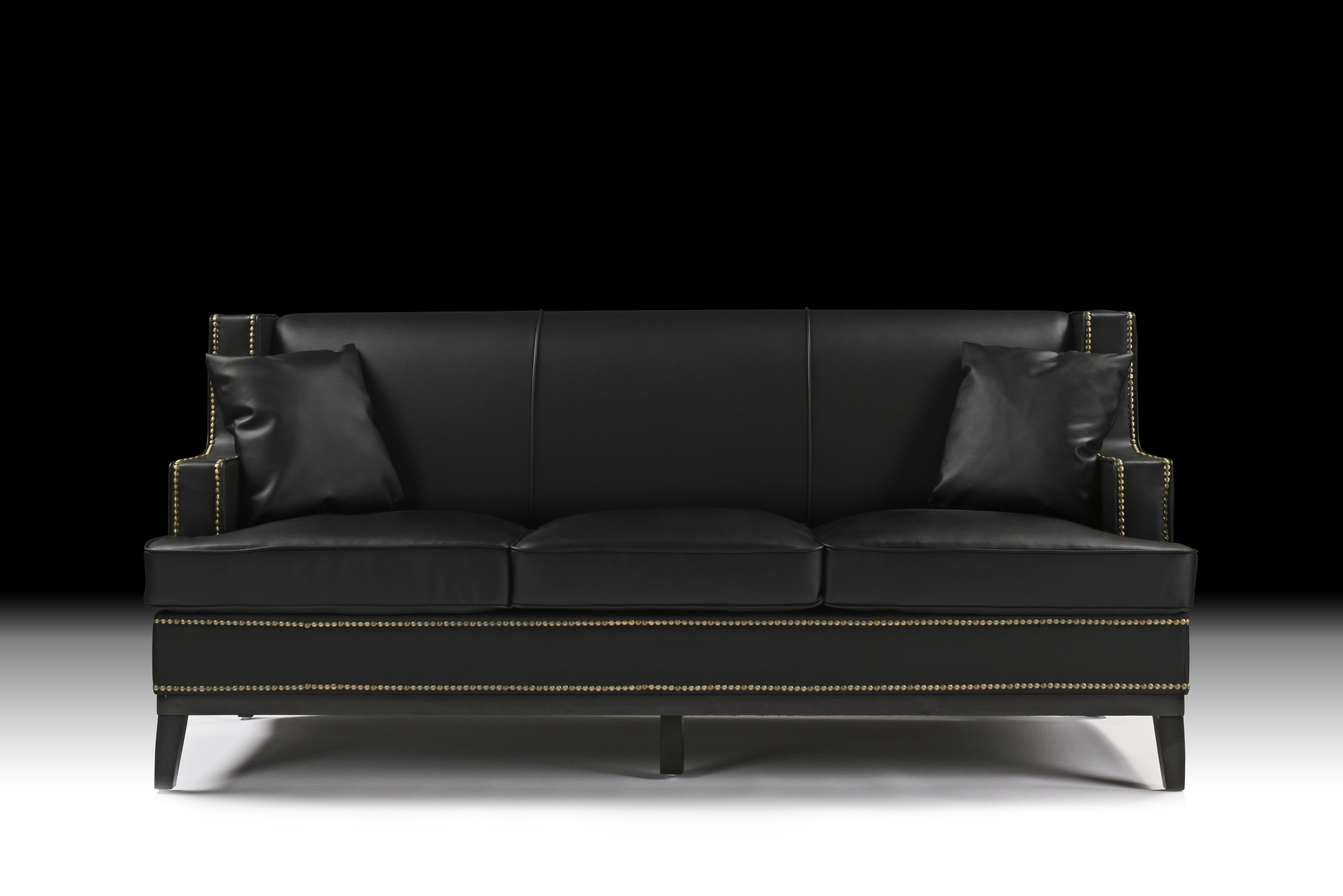 black leather sofa with nailhead trim